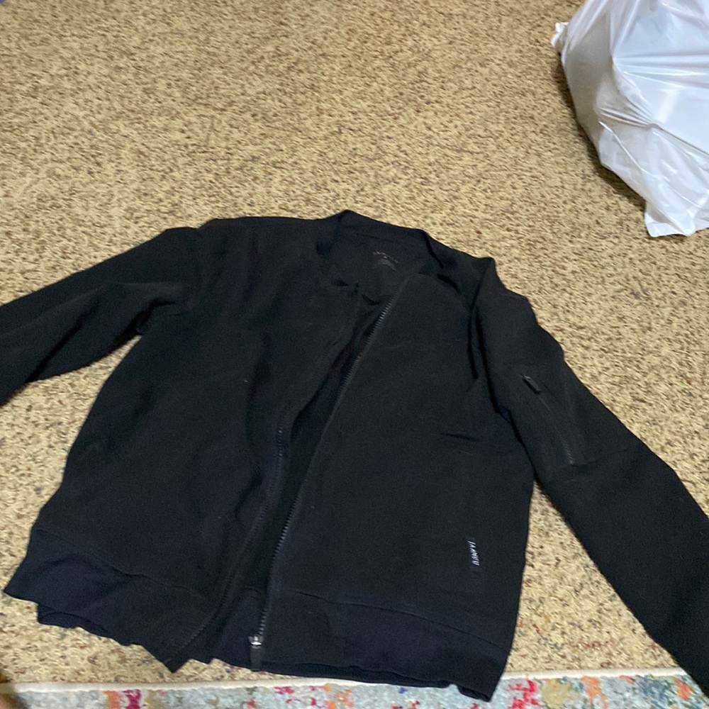 New Jaanuu Scrub Jacket Sz S. No flaws, with a zipper compartment on the sleeve
